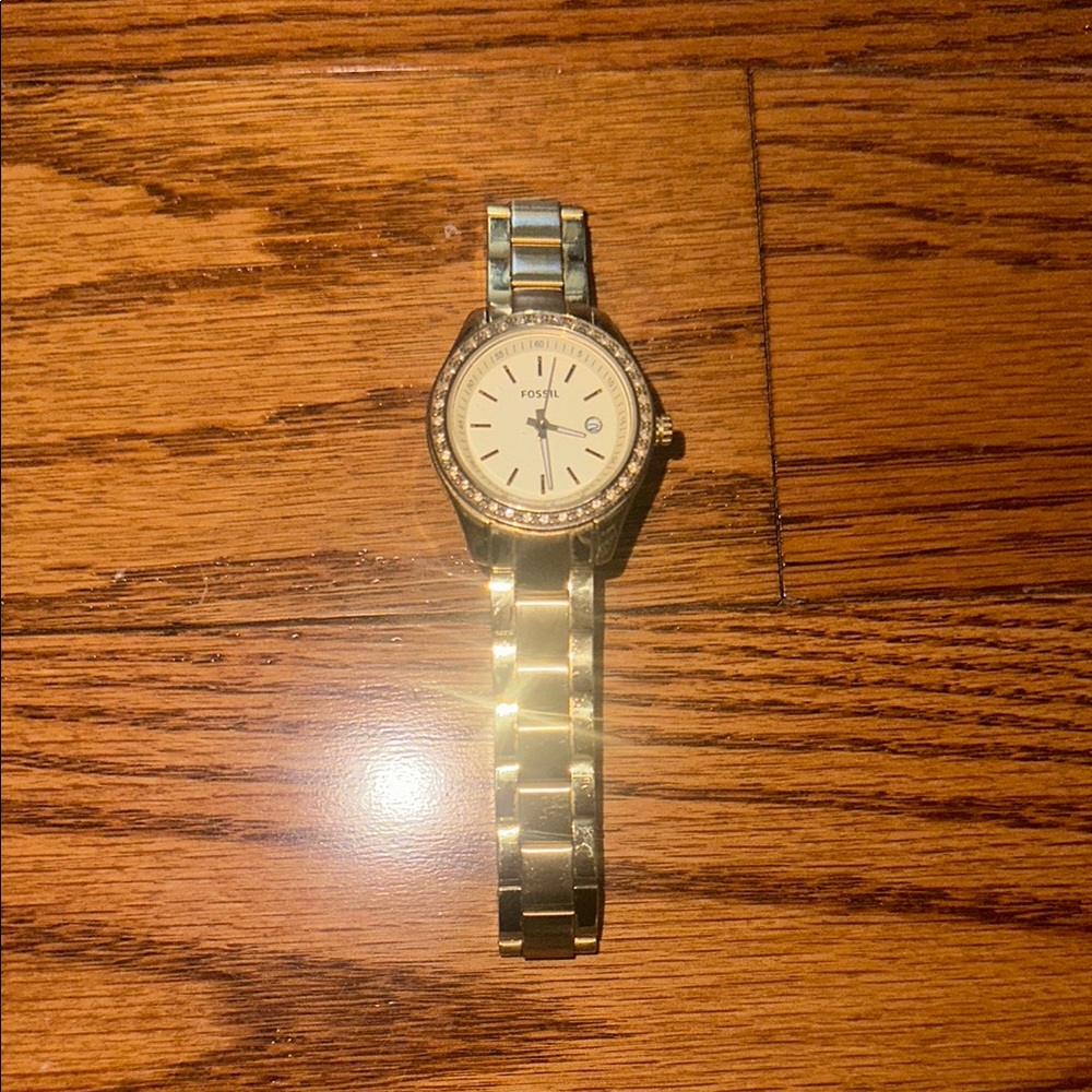 Women’s gold fossil watch